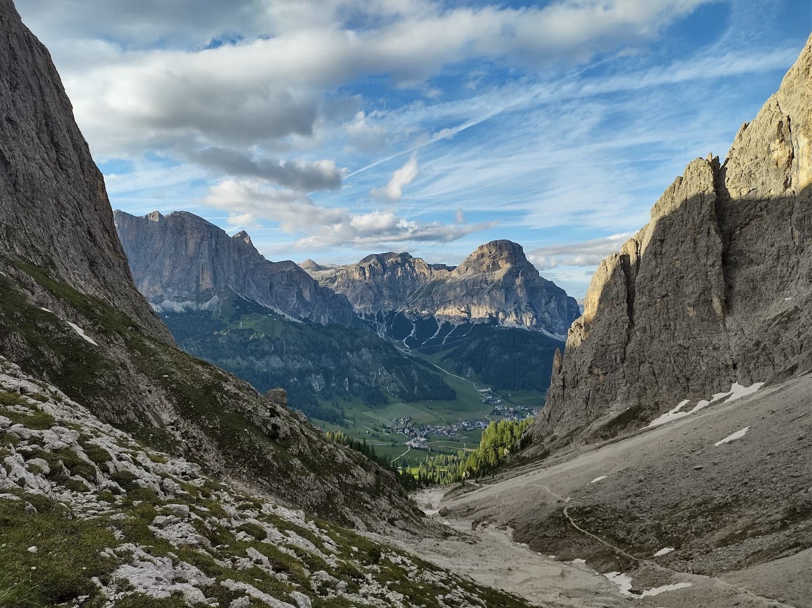 Dolomite gorge opening toward a valley at golden hour